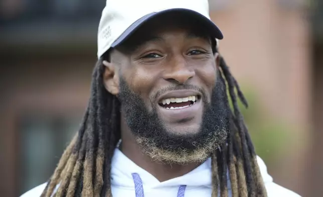 Minnesota Vikings running back Aaron Jones speaks during an interview after NFL football practice at The Grove in Watford, England, Friday, Oct. 4, 2024. (AP Photo/Kin Cheung)