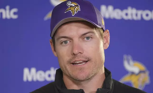 Minnesota Vikings head coach Kevin O'Connell speaks during a news conference after NFL football practice at The Grove in Watford, England, Friday, Oct. 4, 2024. (AP Photo/Kin Cheung)