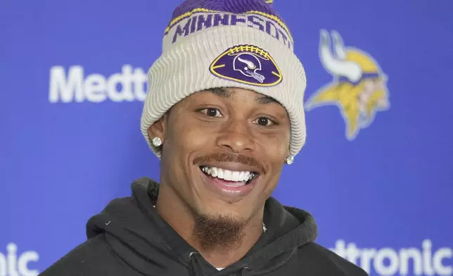 Minnesota Vikings wide receiver Justin Jefferson speaks during a news conference after NFL football practice at The Grove in Watford, England, Friday, Oct. 4, 2024. (AP Photo/Kin Cheung)