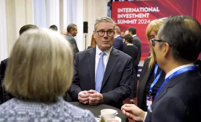 British Prime Minister Sir Keir Starmer, center, speaks with leaders from across the UK during the International Investment Summit in London, Monday, Oct. 14, 2024. (Jonathan Brady/Pool Photo via AP)