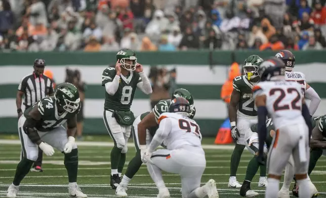 New York Jets quarterback Aaron Rodgers (8) calls an audible at the line of scrimmage against the Denver Broncos during the second quarter of an NFL football game, Sunday, Sept. 29, 2024, in East Rutherford, N.J. (AP Photo/Bryan Woolston)