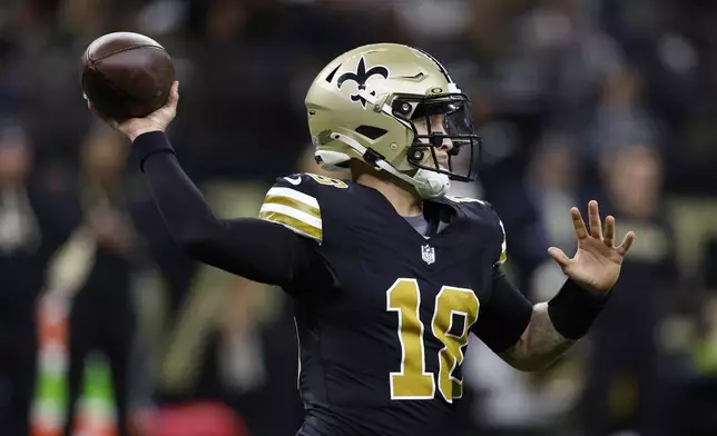 New Orleans Saints quarterback Spencer Rattler throws a pass during the first half of an NFL football game against the Denver Broncos, Thursday, Oct. 17, 2024, in New Orleans. (AP Photo/Butch Dill)