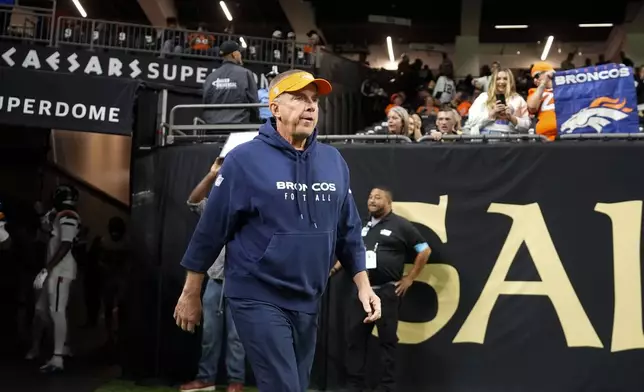 Denver Broncos head coach Sean Payton walks onto the field before an NFL football game against the New Orleans Saints, Thursday, Oct. 17, 2024, in New Orleans. (AP Photo/Gerald Herbert)