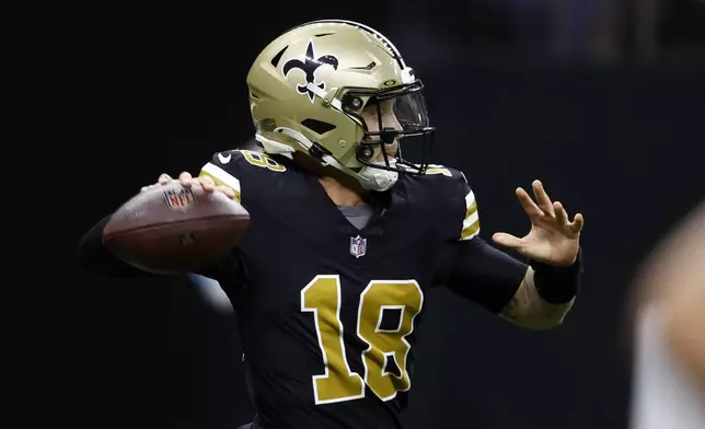 New Orleans Saints quarterback Spencer Rattler throws a pass during the first half of an NFL football game against the Denver Broncos, Thursday, Oct. 17, 2024, in New Orleans. (AP Photo/Butch Dill)