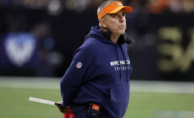 Denver Broncos head coach Sean Payton watches from the sideline during the second half of an NFL football game against the New Orleans Saints, Thursday, Oct. 17, 2024, in New Orleans. (AP Photo/Butch Dill)