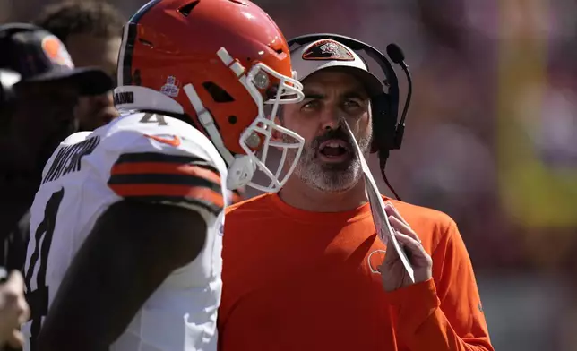 Cleveland Browns head coach Kevin Stefanski, right, talks with quarterback Deshaun Watson, left, during the first half of an NFL football game against the Washington Commanders in Landover, Md., Sunday, Oct. 6, 2024. (AP Photo/Stephanie Scarbrough)