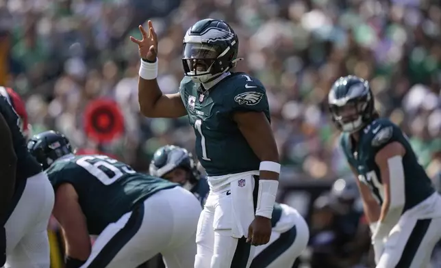 Philadelphia Eagles quarterback Jalen Hurts (1) gestures during the first half of an NFL football game against the Cleveland Browns on Sunday, Oct. 13, 2024, in Philadelphia. (AP Photo/Matt Rourke)