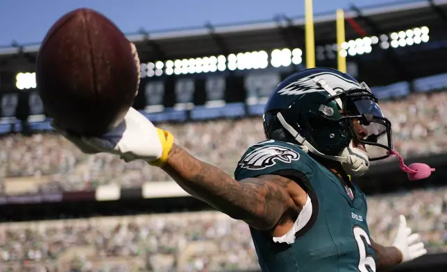 Philadelphia Eagles wide receiver DeVonta Smith (6) celebrates after scoring a touchdown during the second half of an NFL football game against the Cleveland Browns on Sunday, Oct. 13, 2024, in Philadelphia. (AP Photo/Matt Slocum)