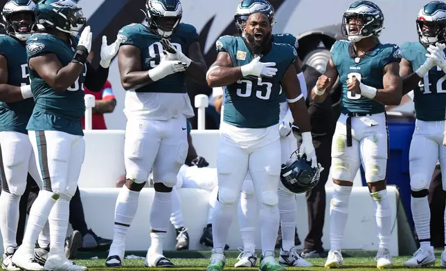 Philadelphia Eagles defensive end Brandon Graham (55) celebrates his 200th start for the Eagles during the first half of an NFL football game against the Cleveland Browns on Sunday, Oct. 13, 2024, in Philadelphia. (AP Photo/Chris Szagola)