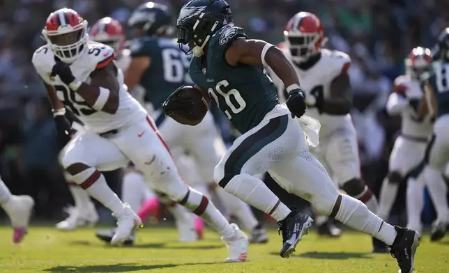 Philadelphia Eagles running back Saquon Barkley (26) carries the ball during the second half of an NFL football game against the Cleveland Browns on Sunday, Oct. 13, 2024, in Philadelphia. (AP Photo/Matt Rourke)