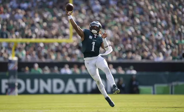 Philadelphia Eagles quarterback Jalen Hurts (1) passes the ball during the second half of an NFL football game against the Cleveland Browns on Sunday, Oct. 13, 2024, in Philadelphia. (AP Photo/Matt Rourke)