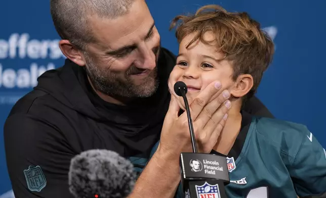 Philadelphia Eagles head coach Nick Sirianni speaks during a news conference with son Miles after an NFL football game against the Cleveland Browns on Sunday, Oct. 13, 2024, in Philadelphia. (AP Photo/Chris Szagola)