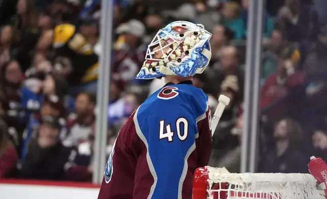 Colorado Avalanche goaltender Alexandar Georgiev reacts after giving up a goal to Boston Bruins defenseman Hampus Lindholm in the second period of an NHL hockey game Wednesday, Oct. 16, 2024, in Denver. (AP Photo/David Zalubowski)