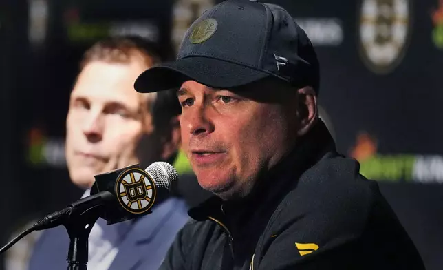 Boston Bruins head coach Jim Montgomery answers a reporter's question during a media availability, Monday, Sept. 30, 2024, in Boston. (AP Photo/Charles Krupa)