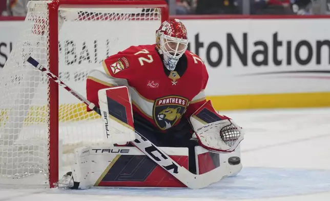 Florida Panthers goaltender Sergei Bobrovsky (72) makes a save in the first period during an NHL hockey game against the Boston Bruins, Tuesday, Oct. 8, 2024, in Sunrise, Fla. (AP Photo/Jim Rassol)