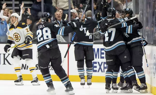 Utah Hockey Club celebrates a goal during the third period of an NHL hockey game against the Boston Bruins, Saturday, Oct. 19, 2024, in Salt Lake City. (AP Photo/Spenser Heaps)