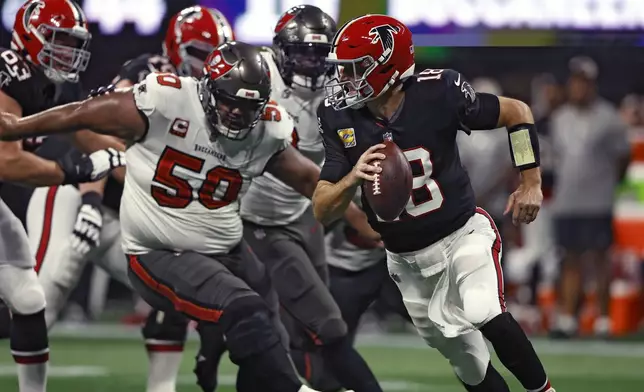 Atlanta Falcons quarterback Kirk Cousins (18) scrambles away from Tampa Bay Buccaneers defensive tackle Vita Vea (50) during the first half of an NFL football game Thursday, Oct. 3, 2024, in Atlanta. (AP Photo/Butch Dill)