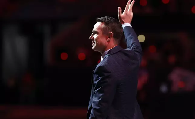 Former Atlanta Falcons quarterback Matt Ryan reacts as he is inducted in the Falcons' Ring of Honor during the first half of an NFL football game against the Tampa Bay Buccaneers Thursday, Oct. 3, 2024, in Atlanta. (AP Photo/Butch Dill)