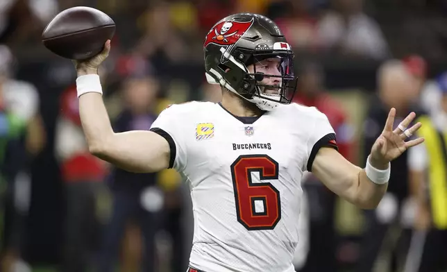 Tampa Bay Buccaneers quarterback Baker Mayfield (6) passes against the New Orleans Saints during the first half of an NFL football game in New Orleans, Sunday, Oct. 13, 2024. (AP Photo/Butch Dill)