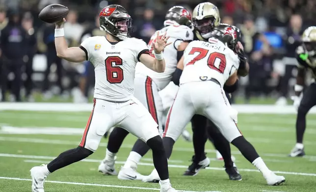 Tampa Bay Buccaneers quarterback Baker Mayfield (6) passes against the New Orleans Saints during the first half of an NFL football game in New Orleans, Sunday, Oct. 13, 2024. (AP Photo/Michael Conroy)