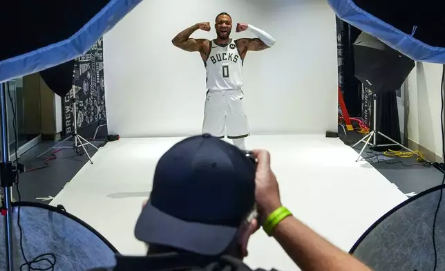 Milwaukeee Bucks' Damian Lillard poses for photos during the NBA basketball team's media day Monday, Sept. 30, 2024, in Milwaukee. (AP Photo/Morry Gash)