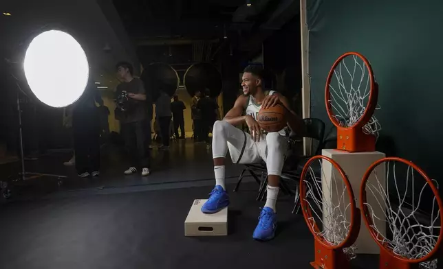 Milwaukeee Bucks' Giannis Antetokounmpo poses for photos during the NBA basketball team's media day Monday, Sept. 30, 2024, in Milwaukee. (AP Photo/Morry Gash)