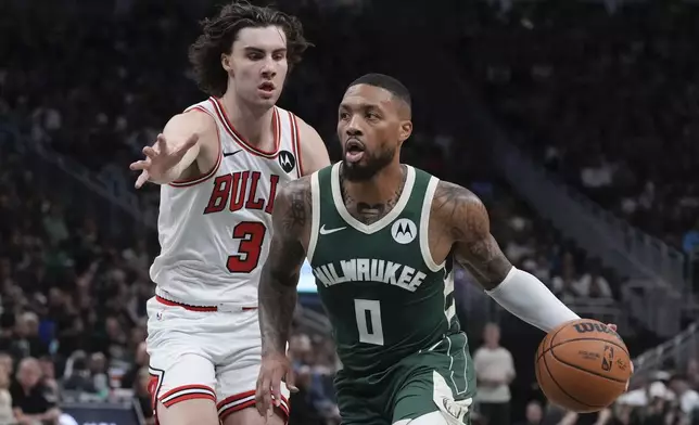 Milwaukee Bucks' Damian Lillard tries to get past Chicago Bulls' Josh Giddey during the first half of an NBA basketball game Friday, Oct. 25, 2024, in Milwaukee. (AP Photo/Morry Gash)