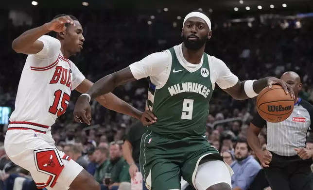 Milwaukee Bucks' Bobby Portis tries to get past Chicago Bulls' Julian Phillips during the first half of an NBA basketball game Friday, Oct. 25, 2024, in Milwaukee. (AP Photo/Morry Gash)