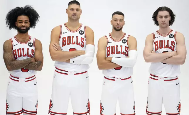 Chicago Bulls from left, Coby White, Nikola Vucevic, Zach LaVine and Josh Giddey stand for a portrait during the NBA basketball team's media day Monday, Sept. 30, 2024, in Chicago. (AP Photo/Charles Rex Arbogast)