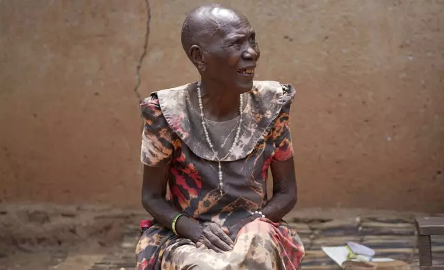 Prudencienne Namukobwa, sits outside her house in Ngozi, Burundi, Friday, Sept. 20, 2024. (AP Photo/Brian Inganga)