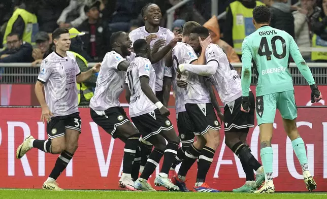 THE GOAL WAS DISALLOWED Udinese's Christian Kabasele, second from right, celebrates with teammates after scoring a disallowed goal during the Serie A soccer match between AC Milan and Udinese at the San Siro Stadium, in Milan, Italy, Saturday, Oct. 19, 2024. (AP Photo/Antonio Calanni)