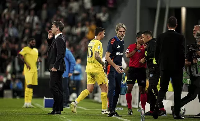 CORRECTS DAY - Lazio's Alessio Romagnoli is issued a red card during the Serie A soccer match against Juventus at the Allianz Stadium in Torino, Italy, Saturday, Oct. 19, 2024. (Marco Alpozzi/LaPresse via AP)