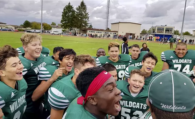 CORRECTS YEAR - Ashton Jeanty, second from right, smiles with his teammates in Spangdahlem, Germany on Sept. 2018. (David Albright via AP)