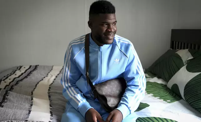 CORRECTS SPELLING OF LAST NAME Cabrel Ngounou, a refugee from Cameroon, poses for a photo in San Francisco, Tuesday, Sept. 17, 2024. (AP Photo/Terry Chea)