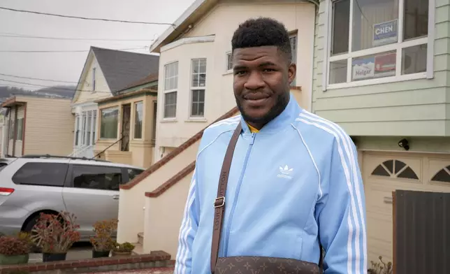 CORRECTS SPELLING OF LAST NAME Cabrel Ngounou, a refugee from Cameroon, poses for a photo in San Francisco, Tuesday, Sept. 17, 2024. (AP Photo/Terry Chea)