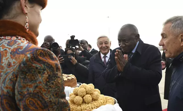 South African President Cyril Ramaphosa, 2nd right, arrives at Kazan International Airport prior to the BRICS summit in Kazan, Russia, Tuesday, Oct. 22, 2024. (Kirill Zykov/Photo host brics-russia2024.ru via AP)