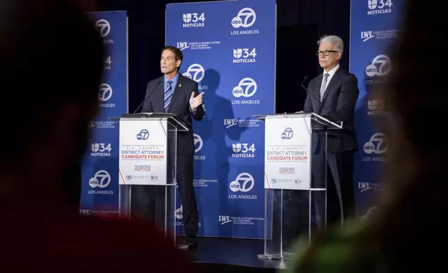 Former federal prosecutor Republican candidate Nathan Hochman, left, and incumbent Democratic Los Angeles County District Attorney George Gascón speak during the 2024 Los Angeles County district attorney candidate forum in Los Angeles, Sunday, Sept. 29, 2024. (AP Photo/Ethan Swope)