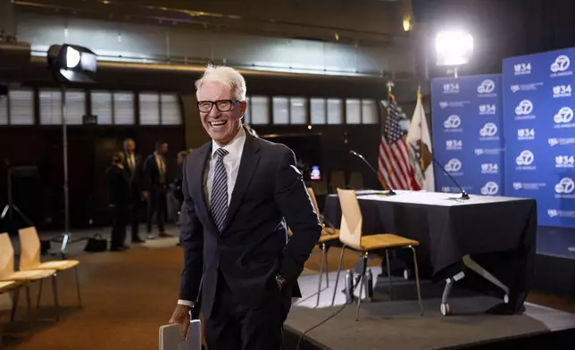 Los Angeles County District Attorney George Gascón greats audience members before the 2024 Los Angeles County district attorney candidate forum with former federal prosecutor Nathan Hochman in Los Angeles, Calif., Sunday, Sept. 29, 2024. (AP Photo/Ethan Swope)