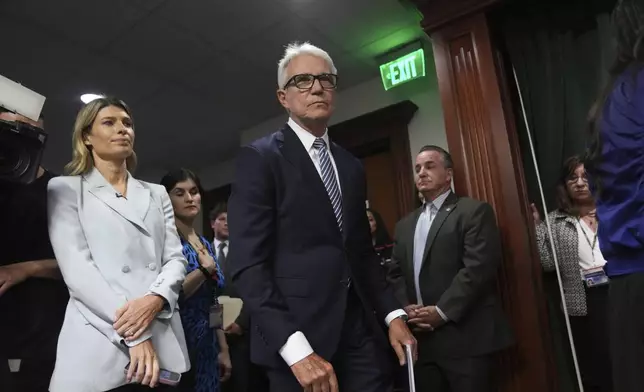 Los Angeles County District Attorney George Gascon, center, arrives at a news conference at the Hall of Justice on Thursday, Oct. 24, 2024, in Los Angeles. (AP Photo/Eric Thayer)