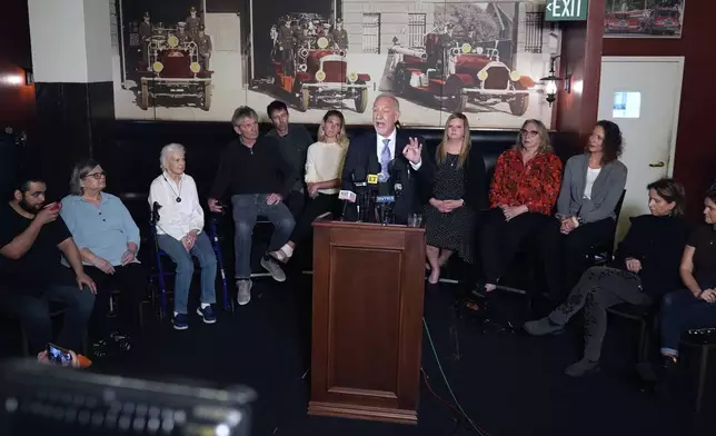 Mark Geragos defense attorney for Erik and Lyle Menendez surrounded by family members talks during a news conference on Thursday, Oct. 24, 2024, in Los Angeles. (AP Photo/Damian Dovarganes)