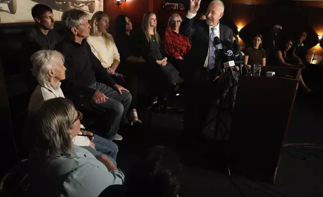 Mark Geragos defense attorney for Erik and Lyle Menendez surrounded by family members talks during a news conference on Thursday, Oct. 24, 2024, in Los Angeles. (AP Photo/Damian Dovarganes)