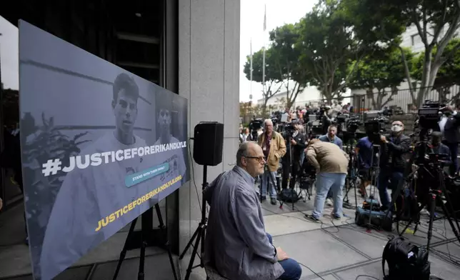 A sign is placed before a press conference to announce developments on the case of brothers Erik and Lyle Menendez, Wednesday, Oct. 16, 2024, in Los Angeles. (AP Photo/Damian Dovarganes)