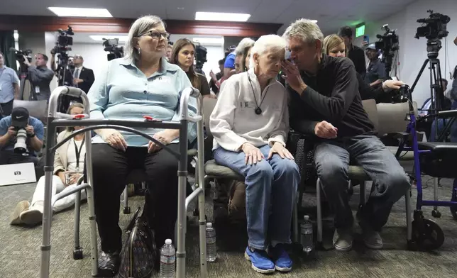 Arnold VanderMolen, Nephew of Kitty Menendez, right, talks with Kitty Menendez's sister, Joan Andersen VanderMolen at a news conference being held by Los Angeles County District Attorney George Gascon on Thursday, Oct. 24, 2024, in Los Angeles. (AP Photo/Eric Thayer)