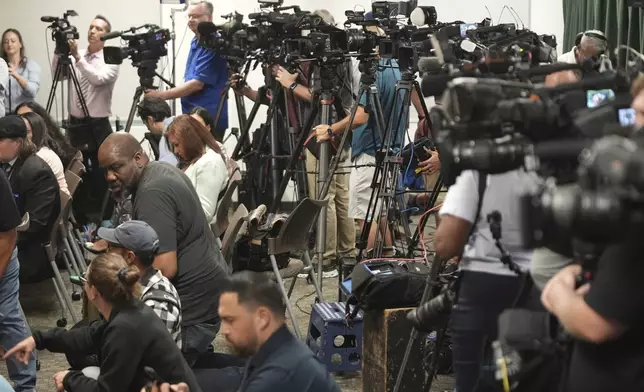 Media gather for a news conference being held by Los Angeles County District Attorney George Gascon on Thursday, Oct. 24, 2024, in Los Angeles. (AP Photo/Damian Dovarganes)