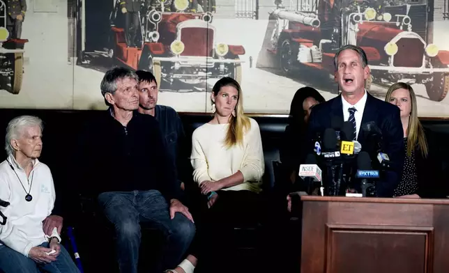 Menendez family attorney Bryan Freedman surrounded by family members as he talks during a news conference on Thursday, Oct. 24, 2024, in Los Angeles. (AP Photo/Damian Dovarganes)