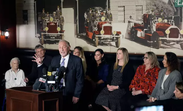 Mark Geragos defense attorney for Erik and Lyle Menendez surrounded by family members talks during a news conference on Thursday, Oct. 24, 2024, in Los Angeles. (AP Photo/Damian Dovarganes)