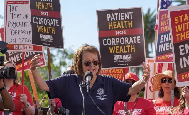 California Democratic state Sen. María Elena Durazo speaks as Kaiser Permanente mental health workers rally outside a Kaiser facility in Los Angeles on Monday, Oct. 21, 2024. (AP Photo/Damian Dovarganes)