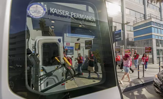 Mental health workers rally outside a Kaiser Permanente facility in Los Angeles Monday, Oct. 21, 2024. (AP Photo/Damian Dovarganes)