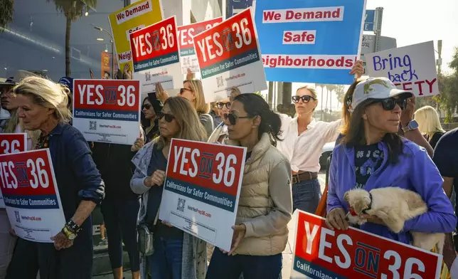 Neighbors and business owners join to support California's Proposition 36 on the November ballot at a news conference in the Venice neighborhood of Los Angeles on Monday, Sept. 30, 2024. (AP Photo/Damian Dovarganes)