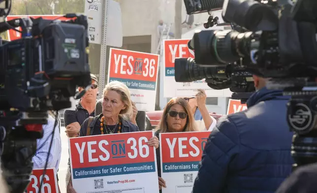 Neighbors and local business owners join in to support California's Proposition 36 on the November ballot at a news conference in the Venice neighborhood of Los Angeles on Monday, Sept. 30, 2024. (AP Photo/Damian Dovarganes)